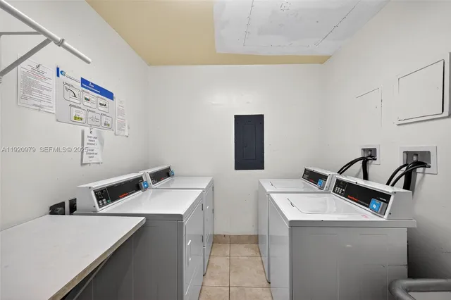 a living room with furniture and large windows