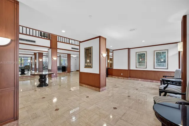 a balcony with furniture and a chandelier