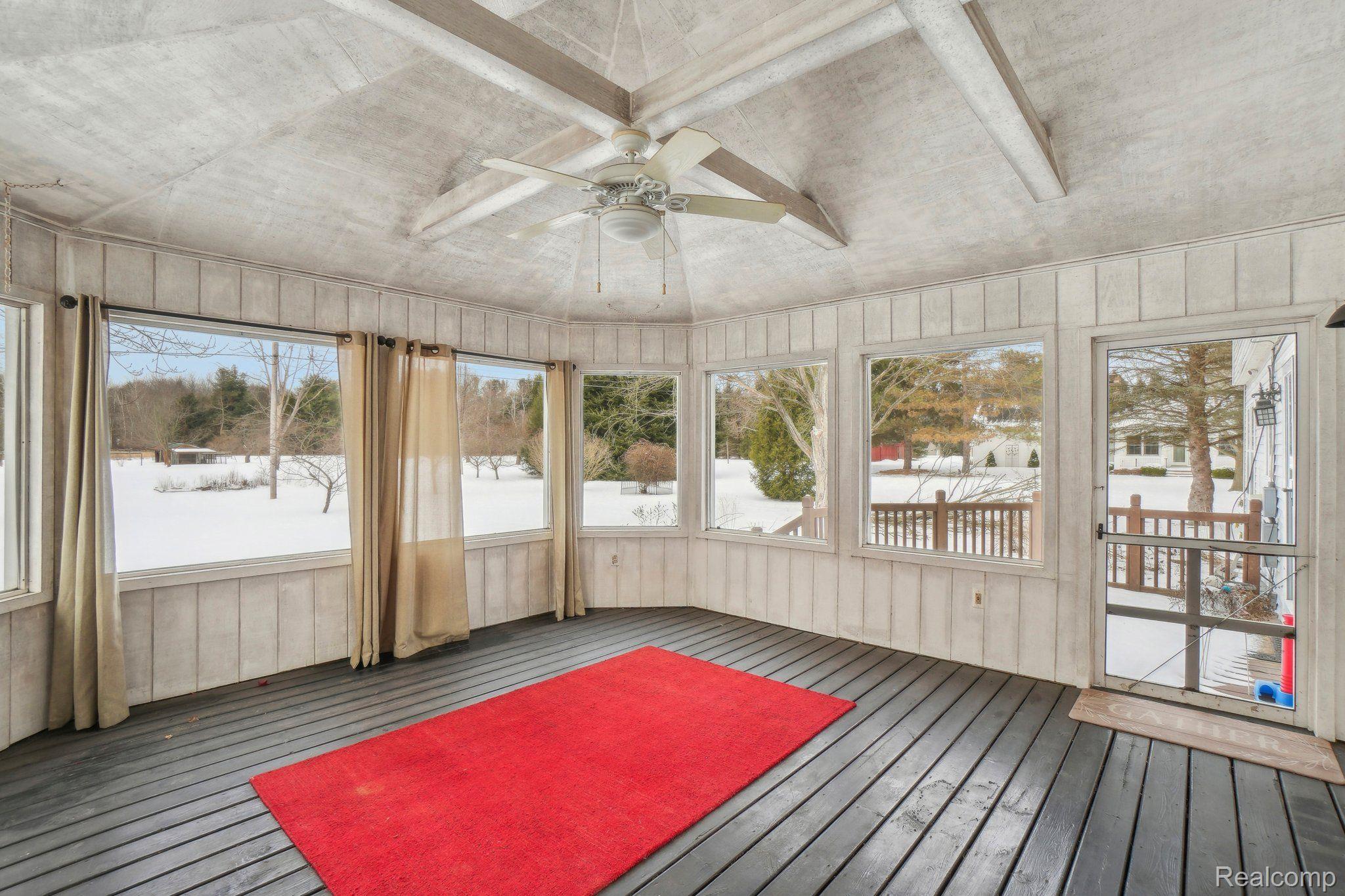 4121 Parker Road Fort Gratiot, MI 48059 - Photo 30 of 54 Screened porch built on deck overlooks rear yard.