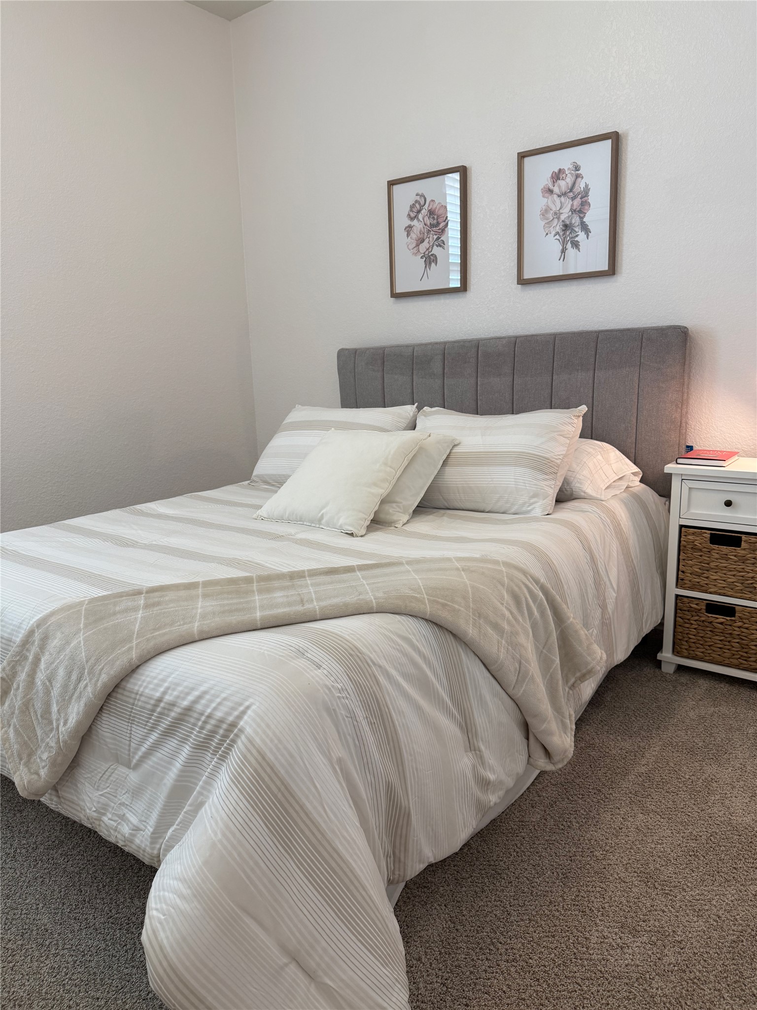 14907 Retha Pass Austin, TX 78725 - Photo 8 of 14 Plush wall-to-wall carpeting and neutral-toned walls ground this quiet sleeping space.