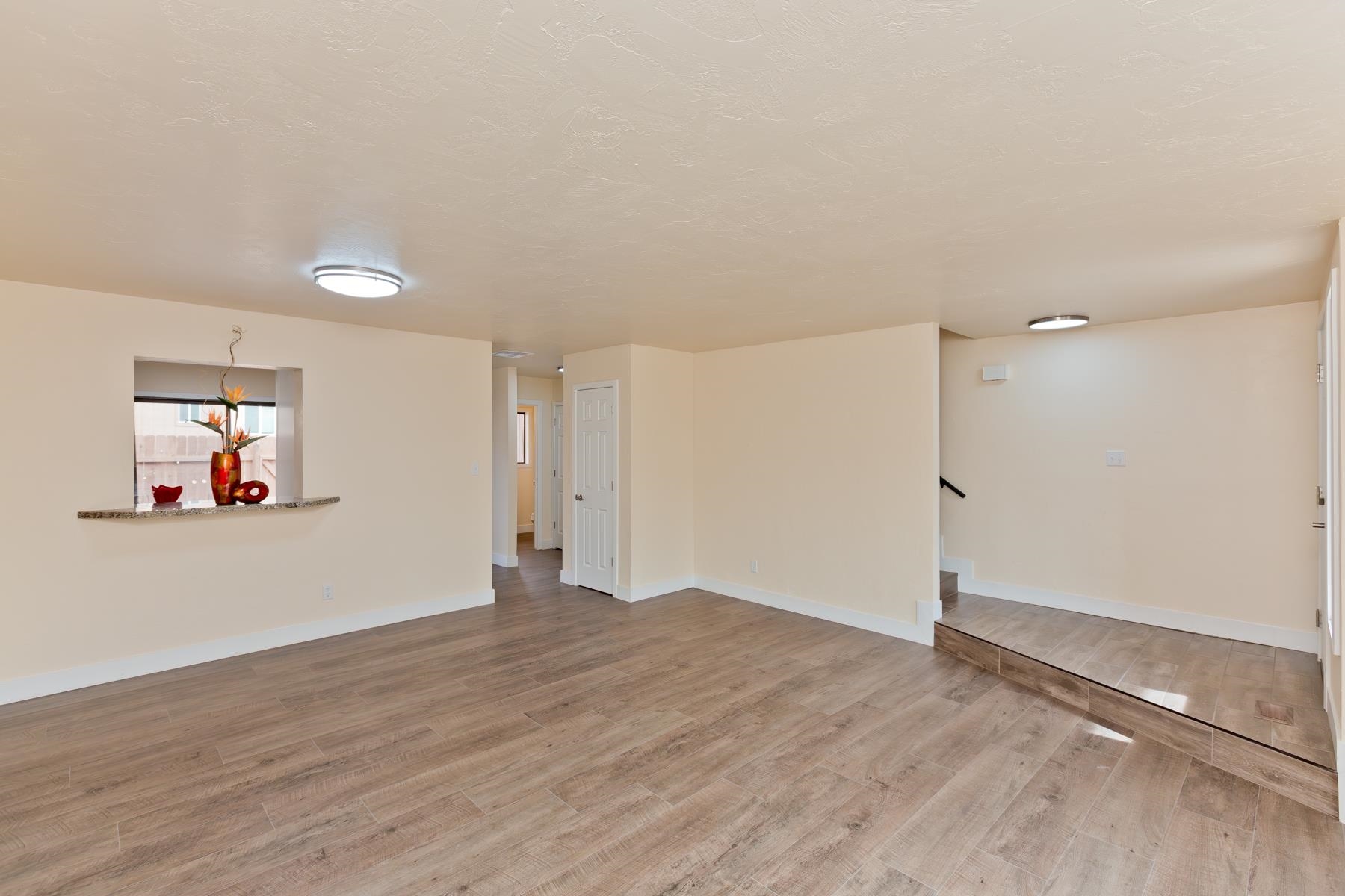 575-28 28 1/2 Road, Unit 44 Grand Junction, CO 81501 - Photo 5 of 39 an empty room with wooden floor and window
