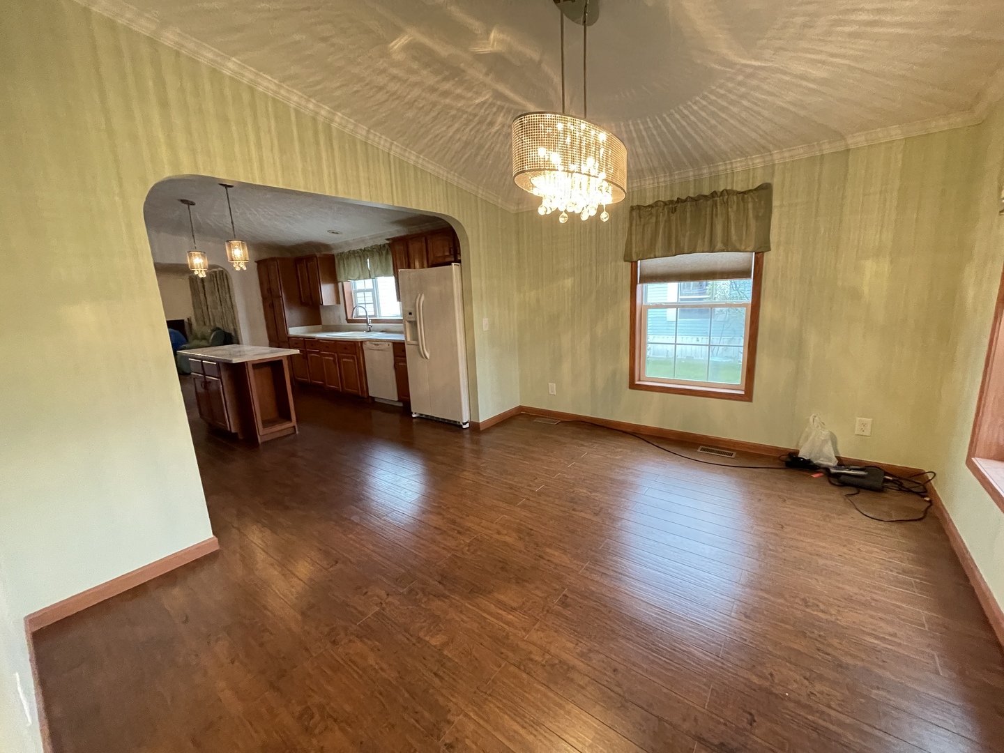 67 Crocus Lane Matteson, IL 60443 - Photo 12 of 30 a view of a room with wooden floor and chandelier