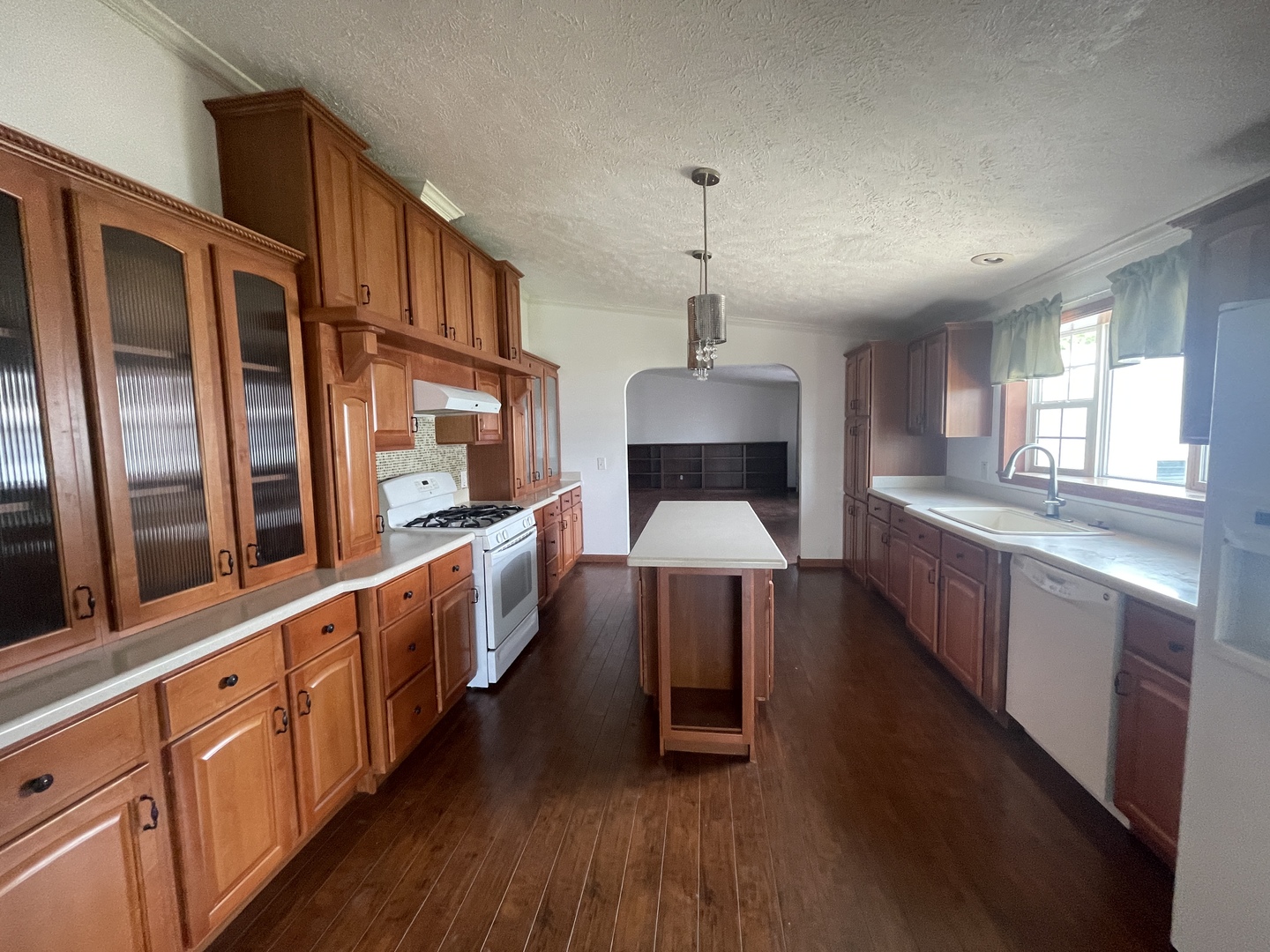 67 Crocus Lane Matteson, IL 60443 - Photo 9 of 30 a large kitchen with stainless steel appliances wooden floors a stove and a wooden floors