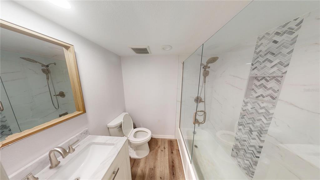 8735 Midnight Pass Road, Unit 206B Sarasota, FL 34242 - Photo 32 of 56 a bathroom with a sink toilet and shower