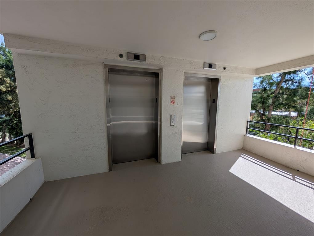 8735 Midnight Pass Road, Unit 206B Sarasota, FL 34242 - Photo 46 of 56 a view of empty room with front door