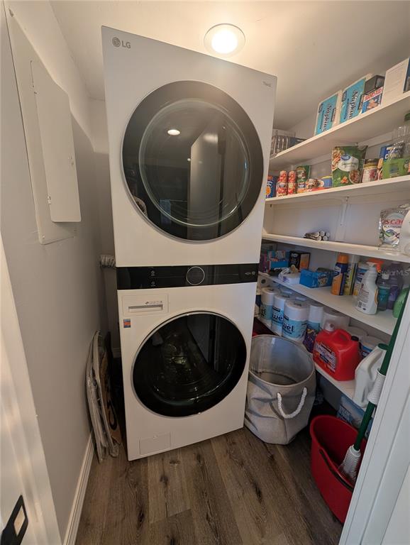 8735 Midnight Pass Road, Unit 206B Sarasota, FL 34242 - Photo 56 of 56 a living room with furniture and a wooden floor