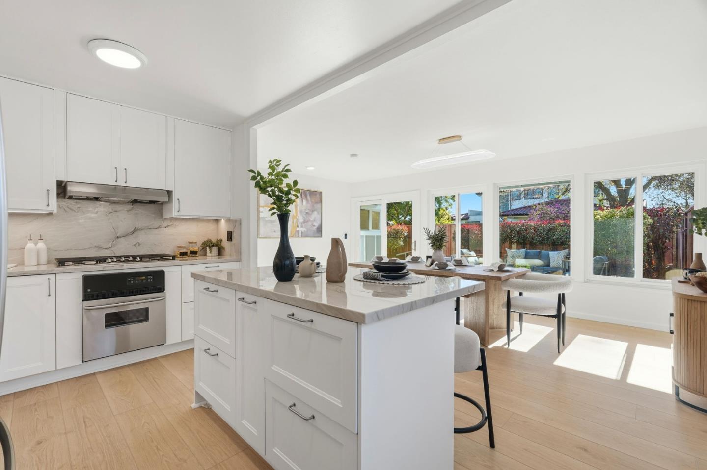 a kitchen with a stove and cabinets