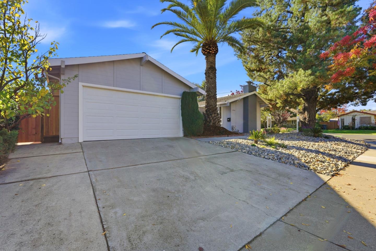 19990 Pear Tree Lane Cupertino, CA 95014 - Photo 3 of 38 a front view of house with yard and trees around