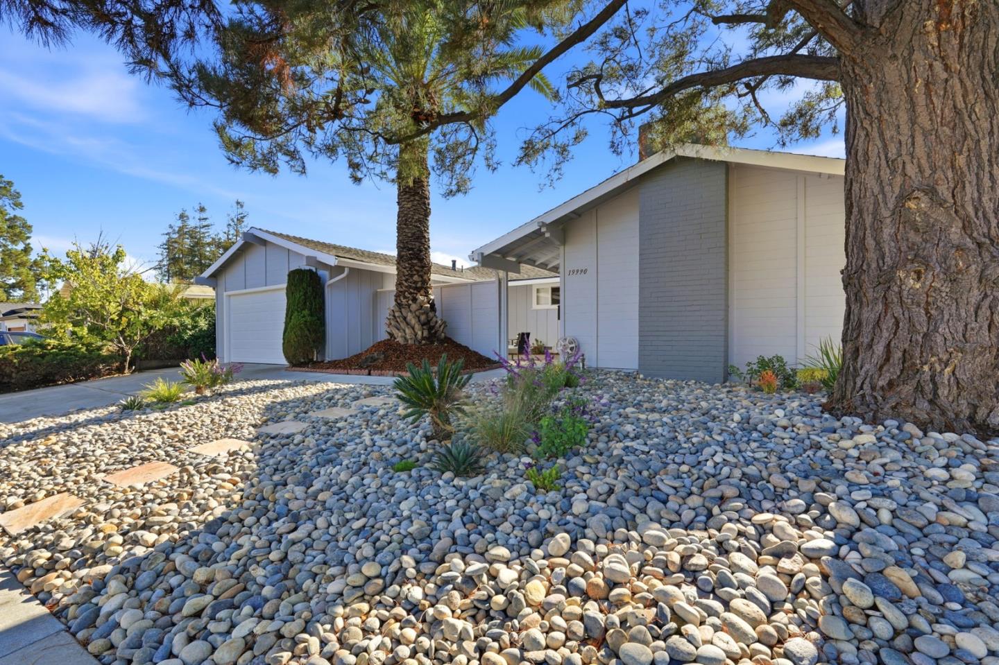 19990 Pear Tree Lane Cupertino, CA 95014 - Photo 4 of 38 a front view of a house with garden