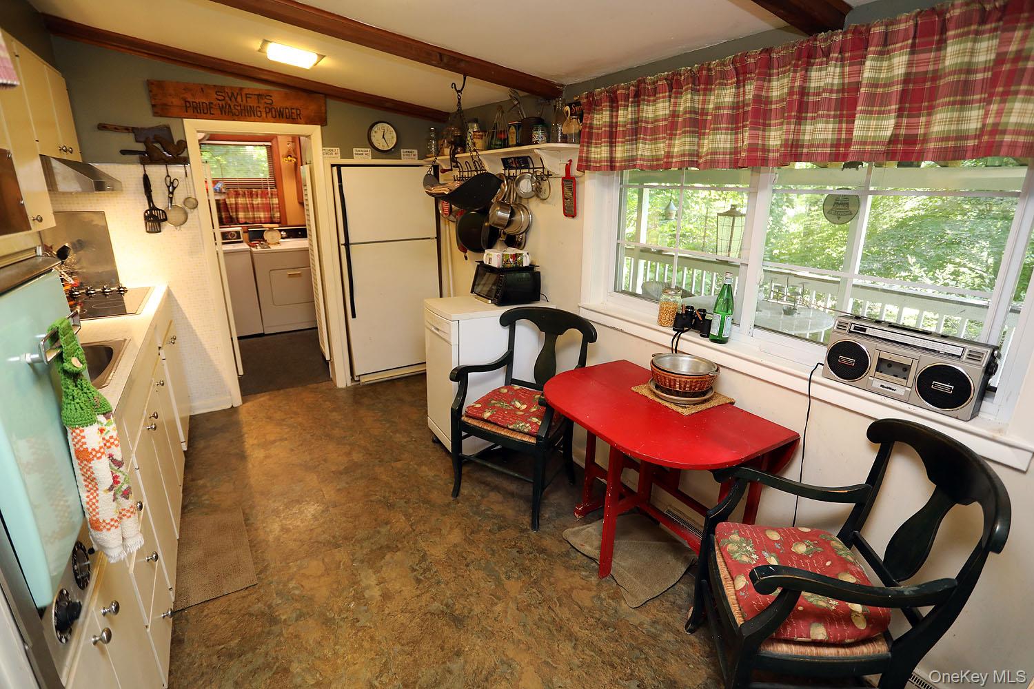 66 Raspberry Park Road Long Eddy, NY 12760 - Photo 14 of 36 Kitchen with eat-in area offering plenty of natural light, with access to the laundry room