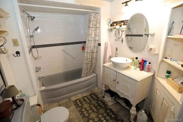 a bedroom with a bed and a flat tv screen