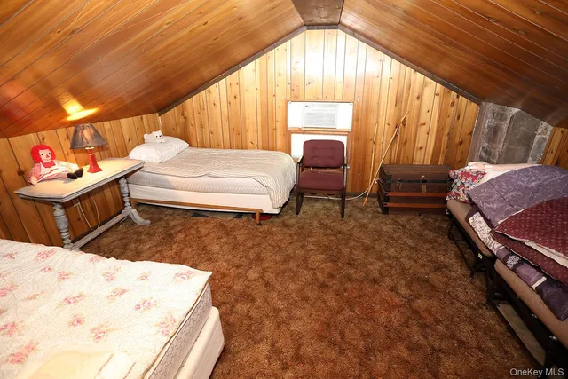 a bedroom with furniture and a window