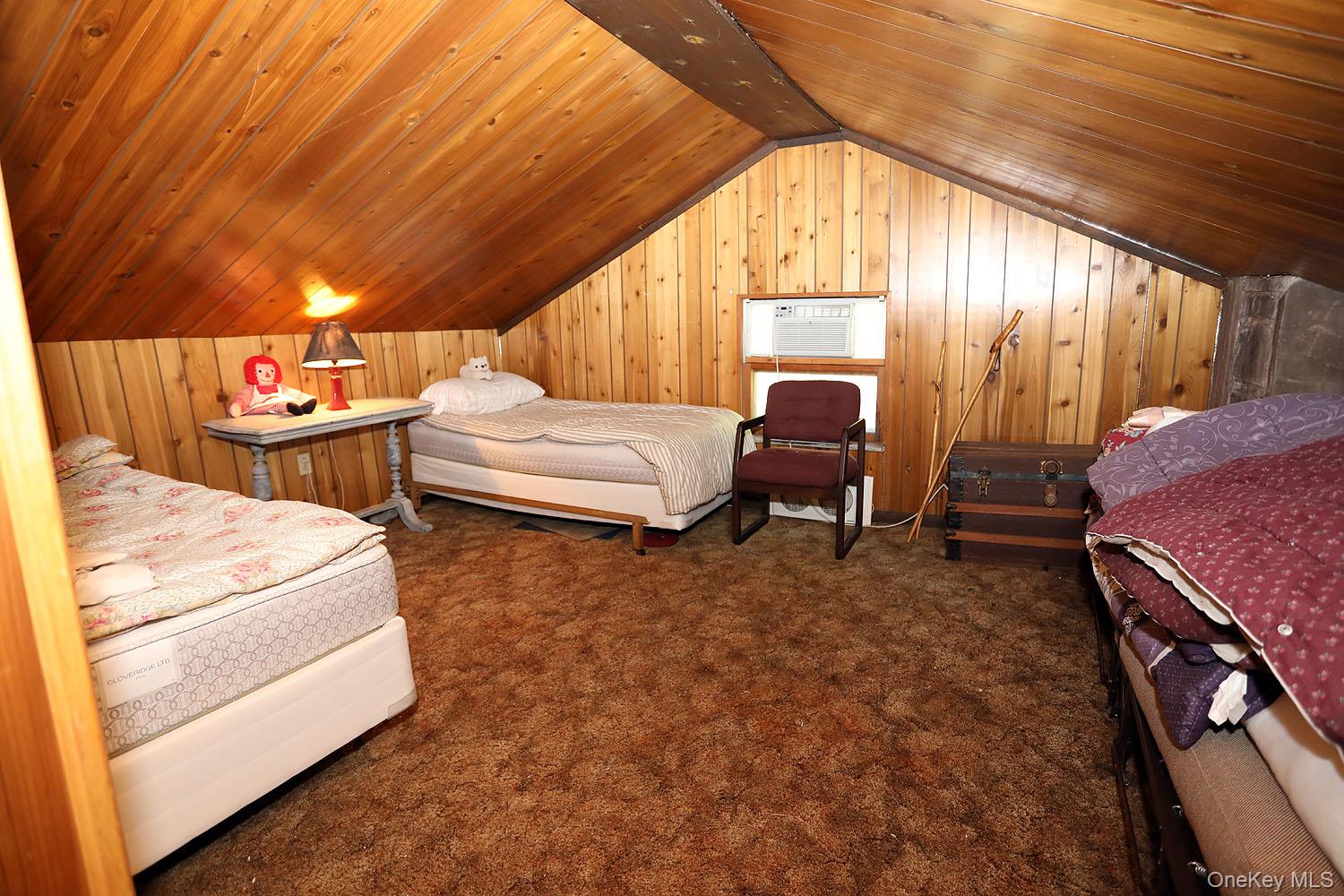 66 Raspberry Park Road Long Eddy, NY 12760 - Photo 31 of 36 Carpeted bedroom featuring wood walls and wood ceiling