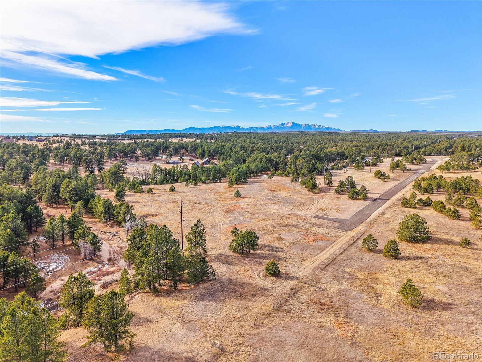 12095 Grandin Elbert, CO 80106 - Photo 11 of 23 a view of a lake with a beach