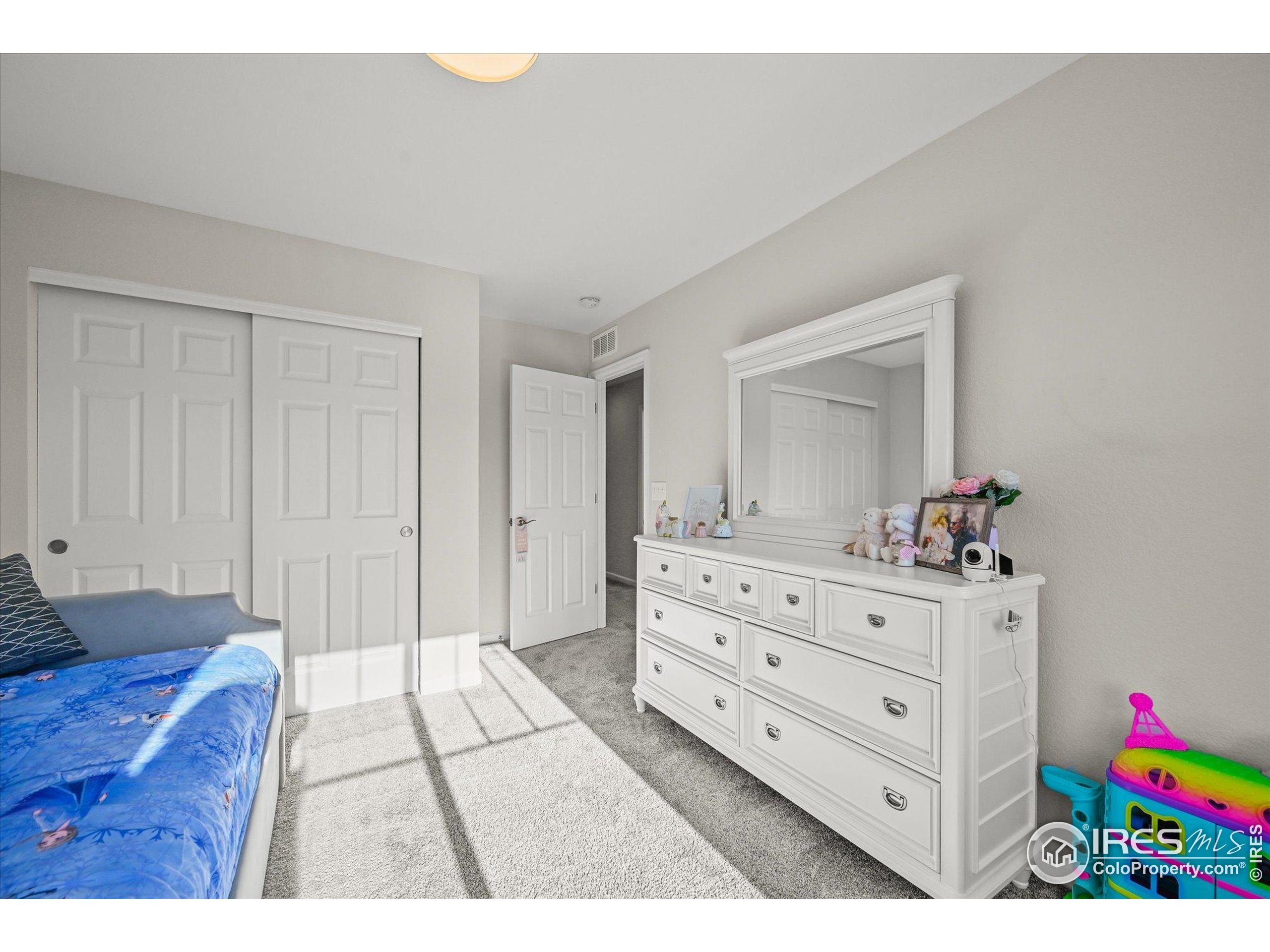950 Rustling Street Windsor, CO 80550 - Photo 29 of 49 a view of room with cabinet and mirror