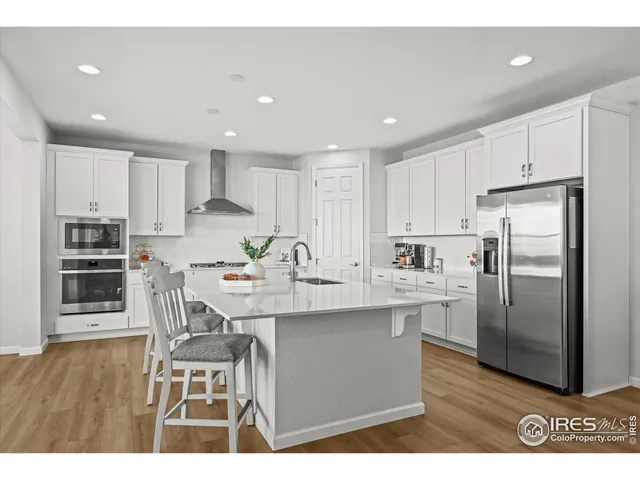 a kitchen with sink and center island