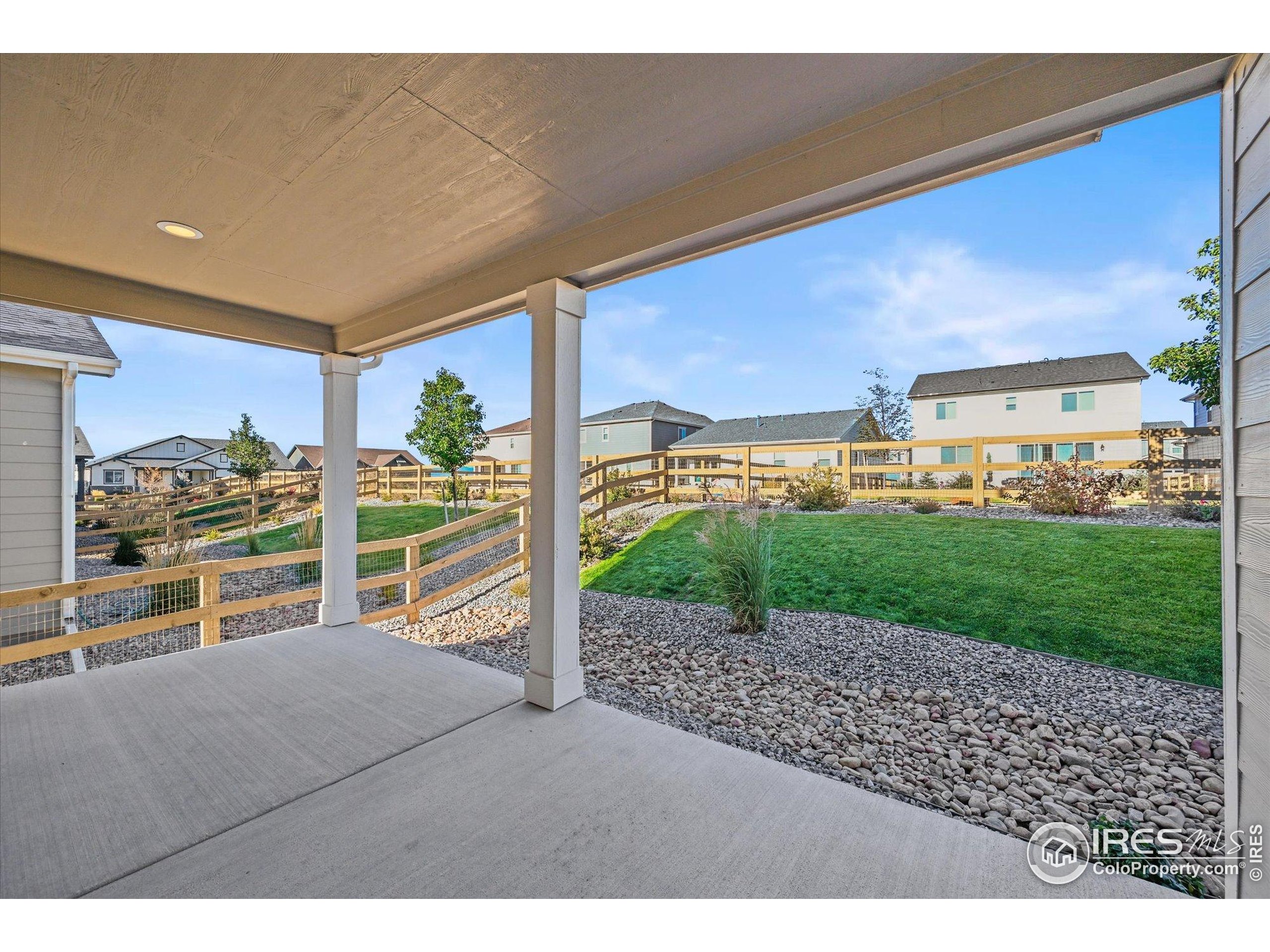950 Rustling Street Windsor, CO 80550 - Photo 40 of 49 a view of a porch with a garden and plants