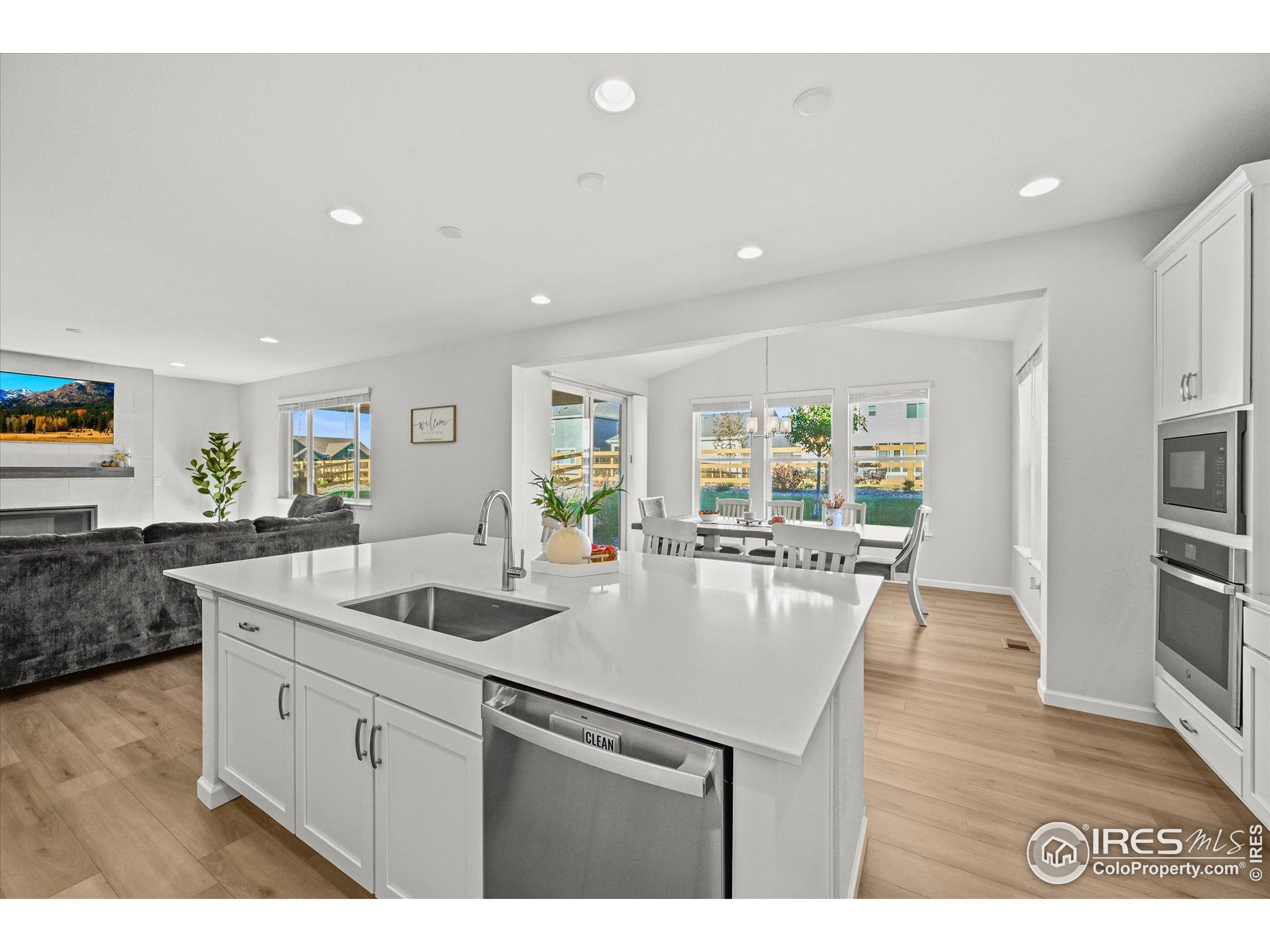 950 Rustling Street Windsor, CO 80550 - Photo 6 of 49 a kitchen with sink and center island