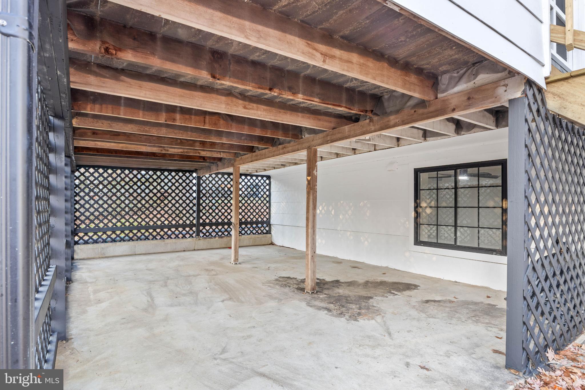 1031 Old Bay Ridge Road Annapolis, MD 21403 - Photo 9 of 48 Spacious covered area with charming latticework.