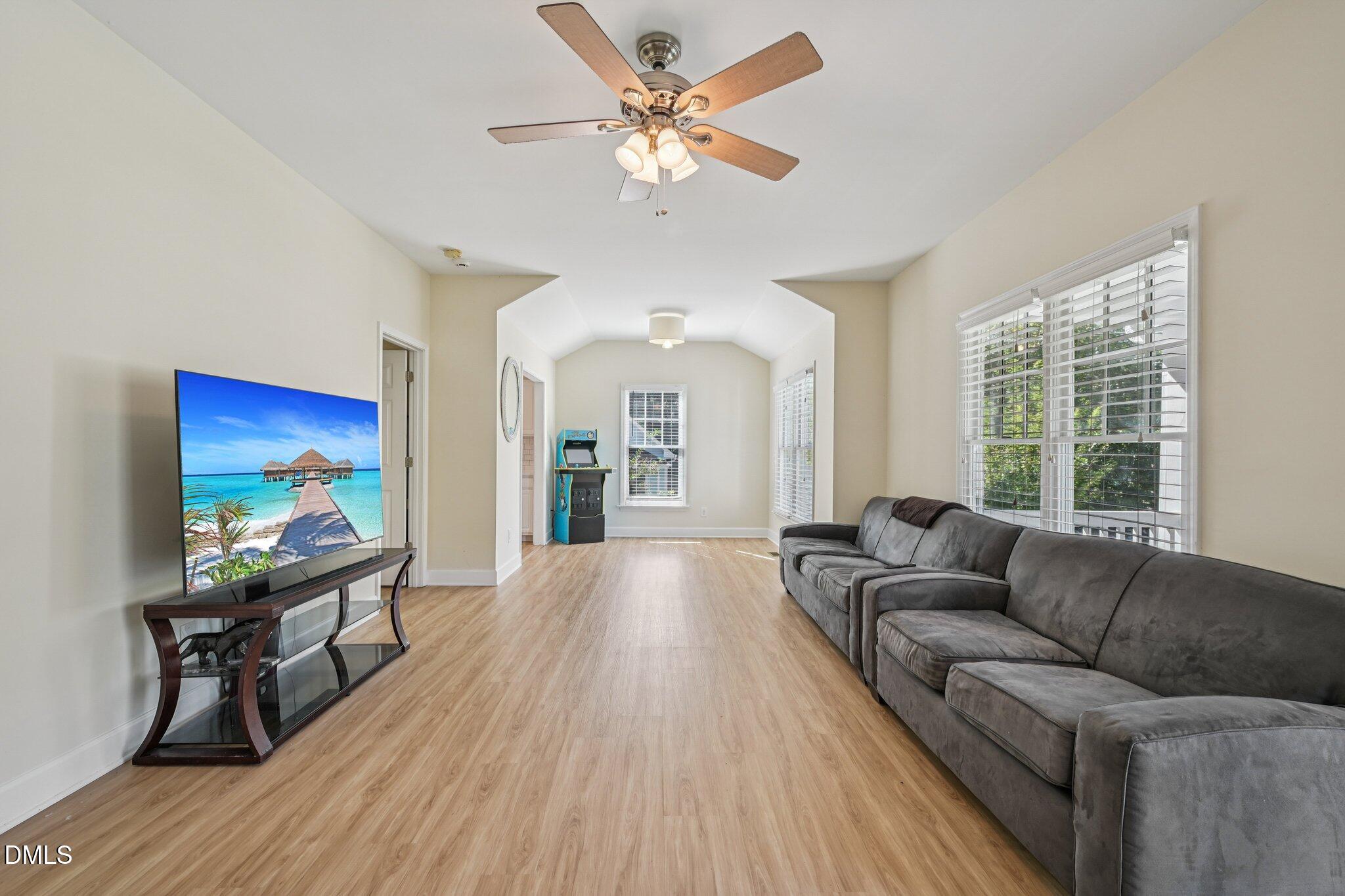 725 South East Street Raleigh, NC 27601 - Photo 8 of 24 a living room with furniture and a flat screen tv