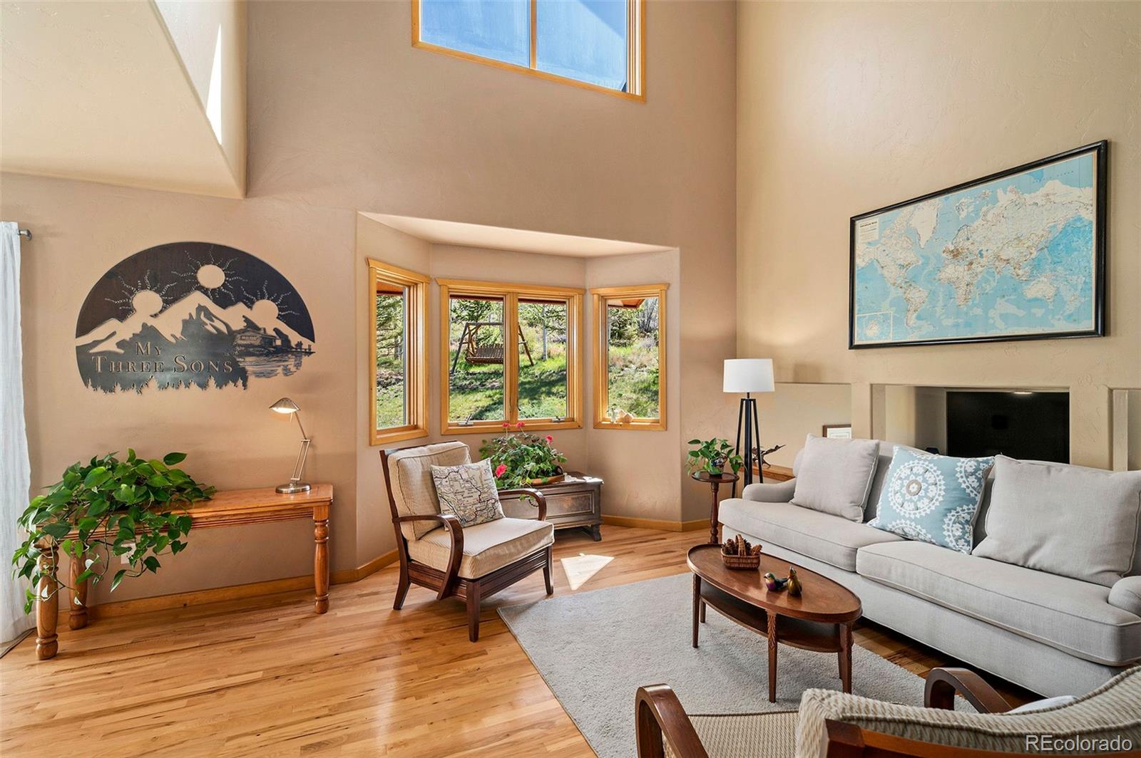 290 Village Road Granby, CO 80446 - Photo 9 of 45 a living room with furniture and a large window with wooden floor