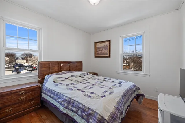 a bathroom with a toilet and a window