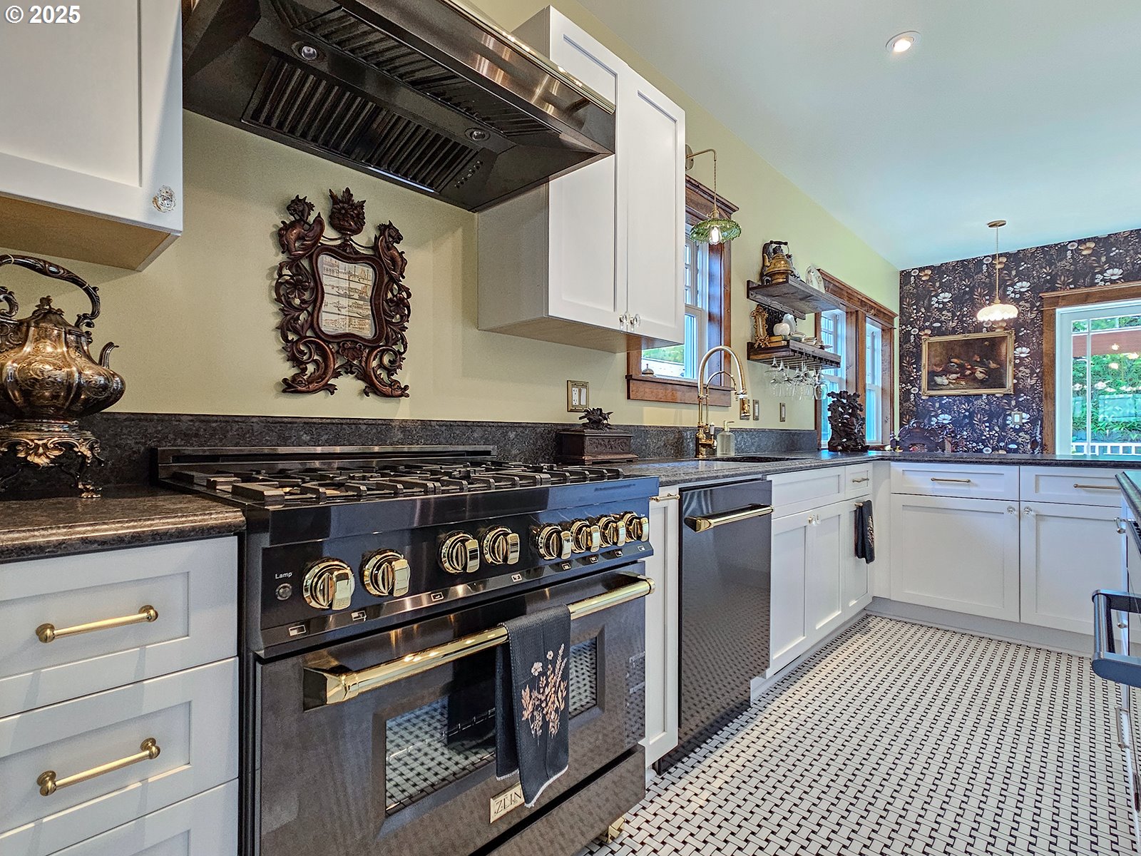 4725 Northeast 22nd Avenue Portland, OR 97211 - Photo 11 of 46 a kitchen with stainless steel appliances granite countertop a stove and a sink