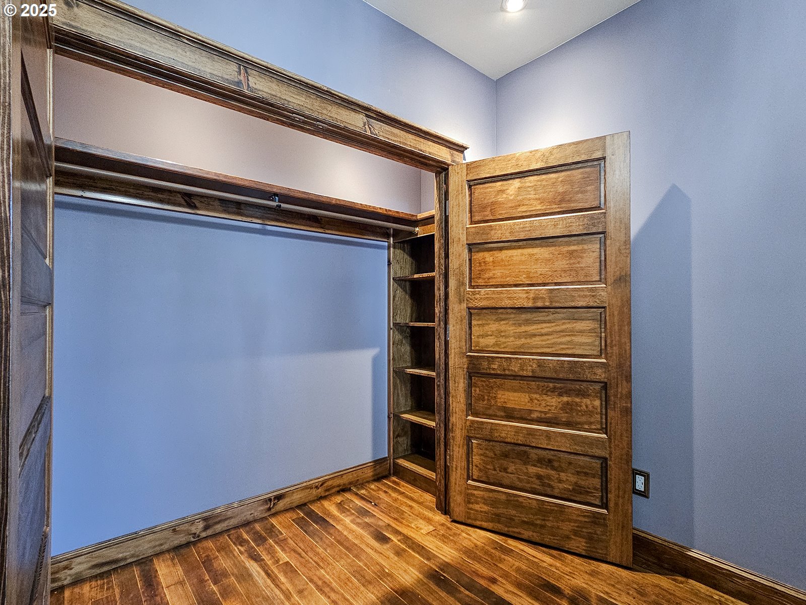 4725 Northeast 22nd Avenue Portland, OR 97211 - Photo 16 of 46 a view of walk in closet with empty racks