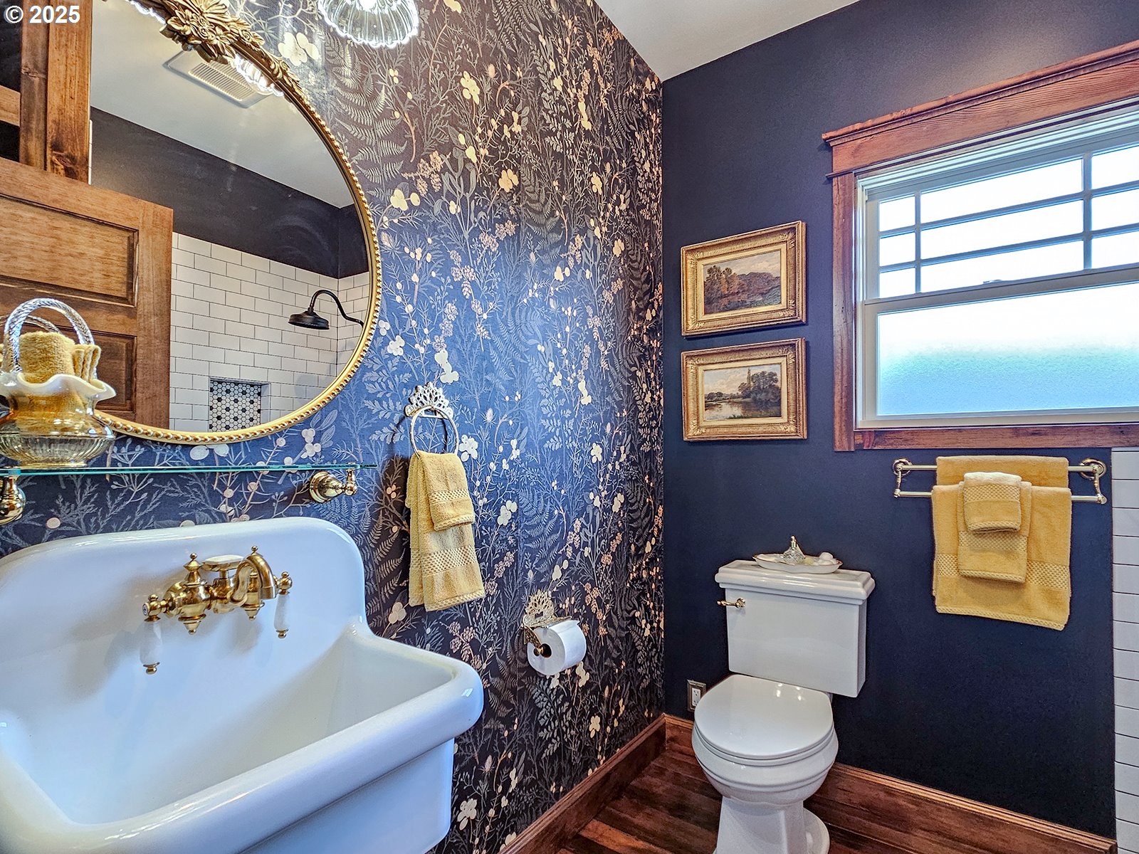 4725 Northeast 22nd Avenue Portland, OR 97211 - Photo 20 of 46 a bathroom with a toilet sink and mirror