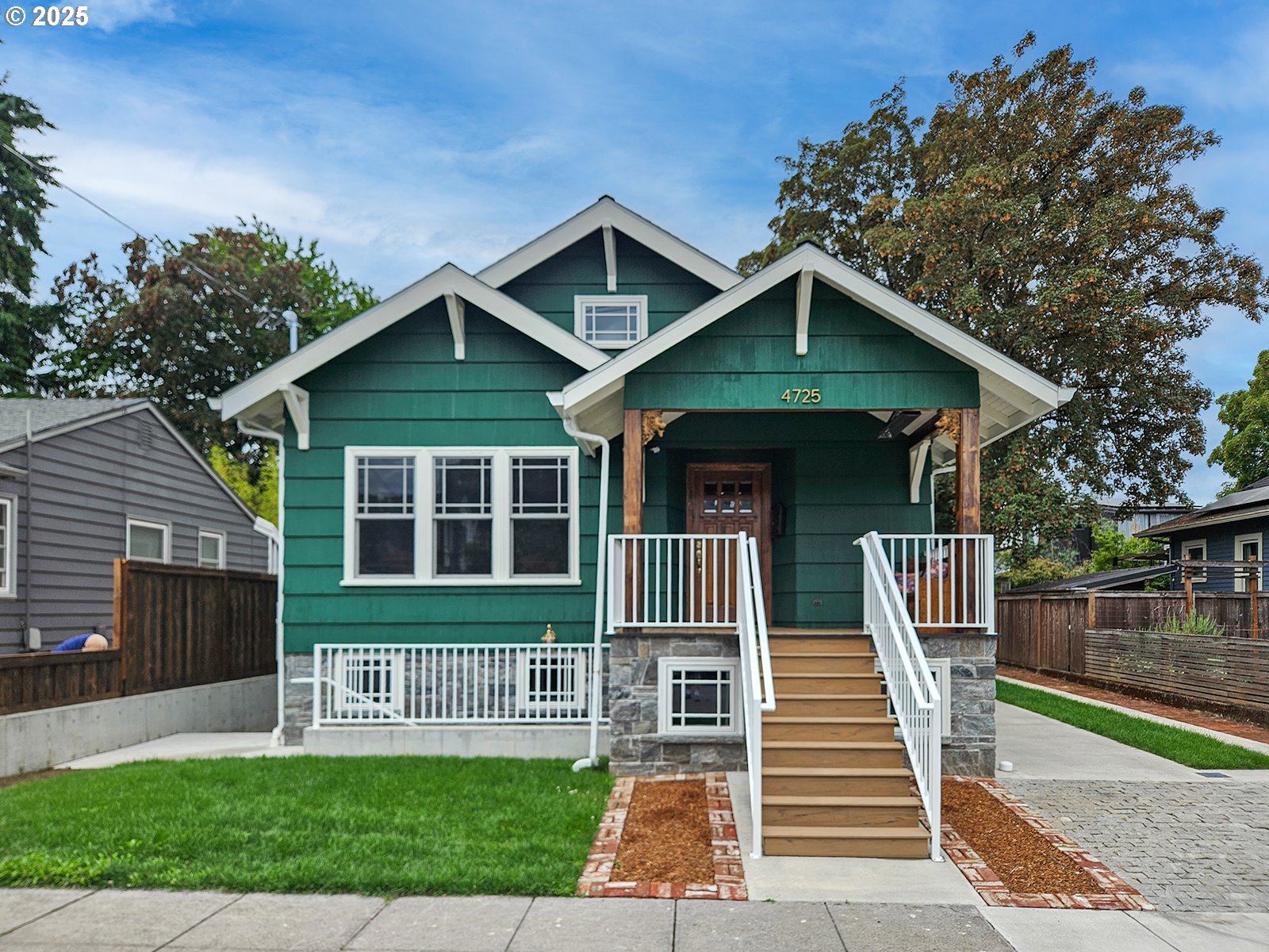 4725 Northeast 22nd Avenue Portland, OR 97211 - Photo 2 of 46 a front view of a house with a yard
