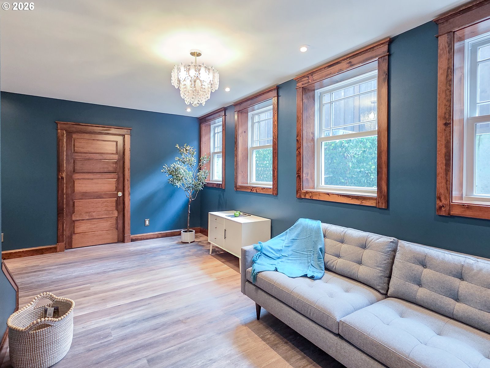 4725 Northeast 22nd Avenue Portland, OR 97211 - Photo 29 of 46 a living room with furniture and a chandelier