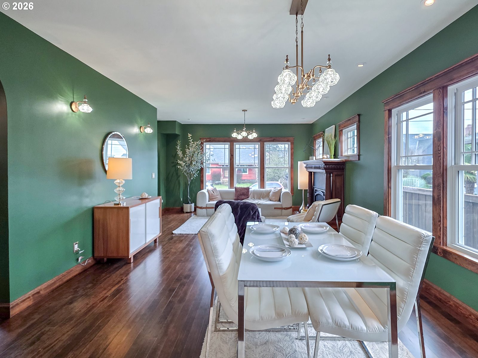 4725 Northeast 22nd Avenue Portland, OR 97211 - Photo 9 of 46 a view of a dining room with furniture a chandelier and wooden floor