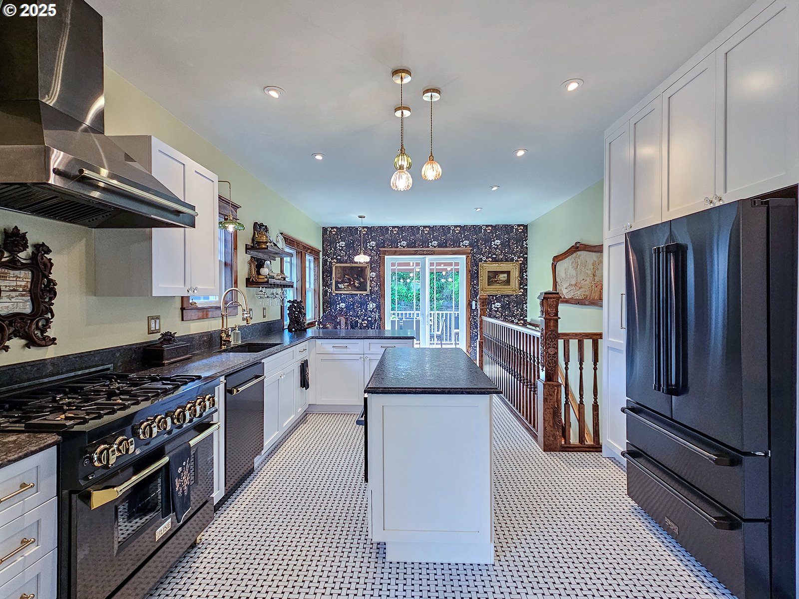 4725 Northeast 22nd Avenue Portland, OR 97211 - Photo 10 of 46 a kitchen with stainless steel appliances granite countertop a stove top oven a sink dishwasher a refrigerator and white cabinets with wooden floor