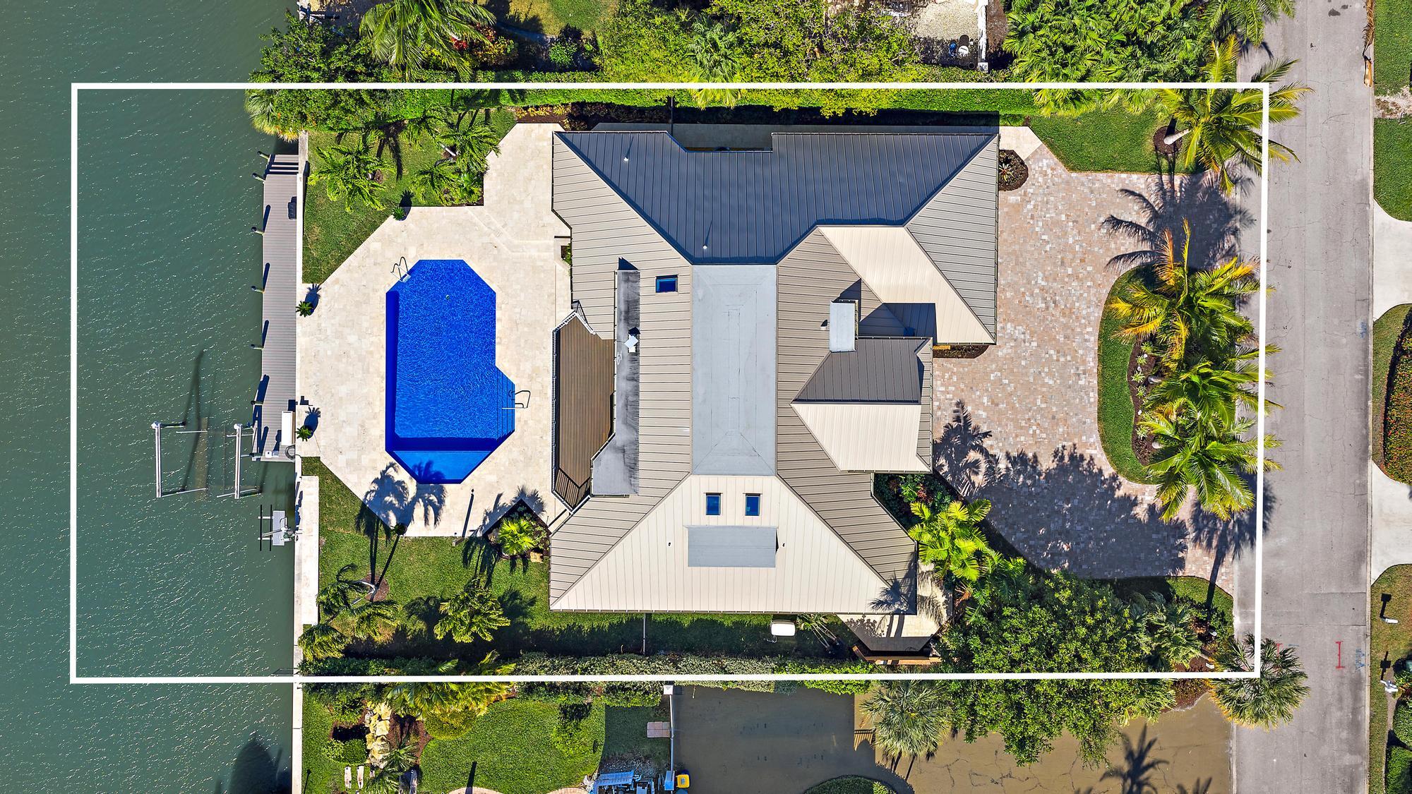 19 Island Road Sewall's Point, FL 34996 - Photo 46 of 50 an aerial view of a house with swimming pool