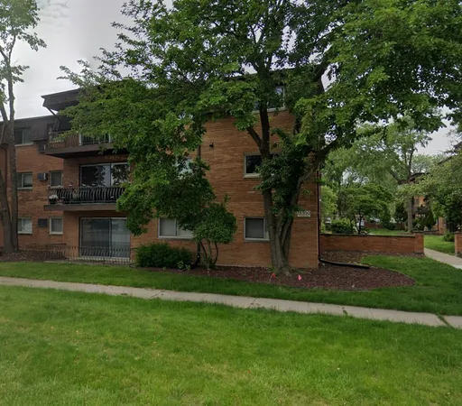 a view of a backyard with large trees