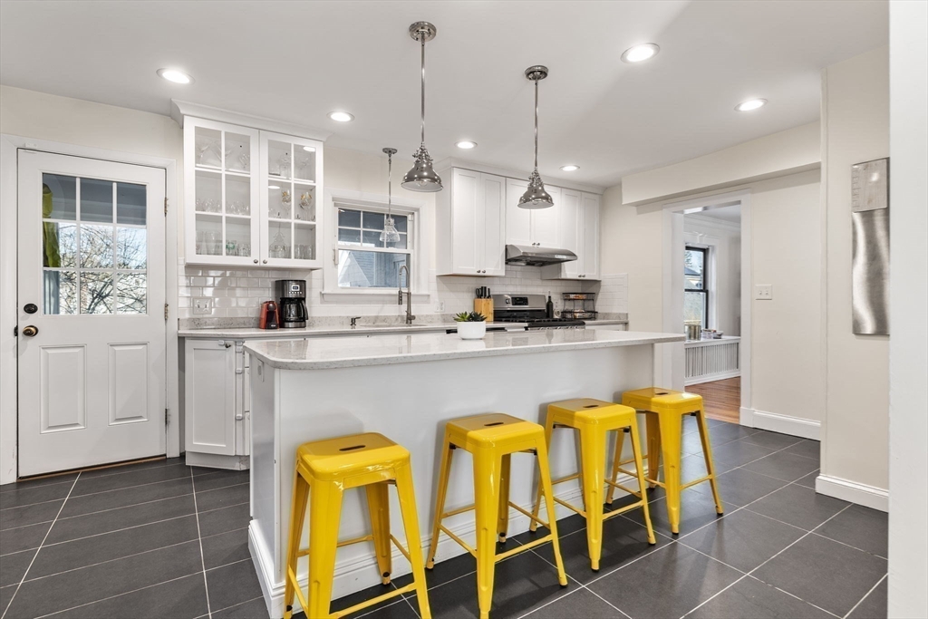 424 Brook Road Milton, MA 02186 - Photo 11 of 41 a kitchen with a sink cabinets and window