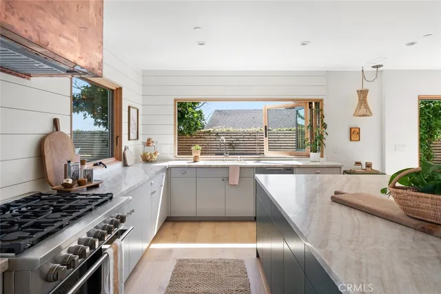 a view of a patio with table and chairs and potted plants