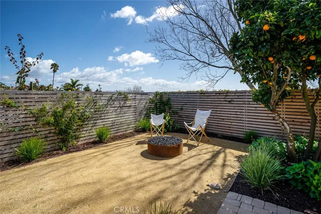 a spacious bedroom with a bed and wooden floor
