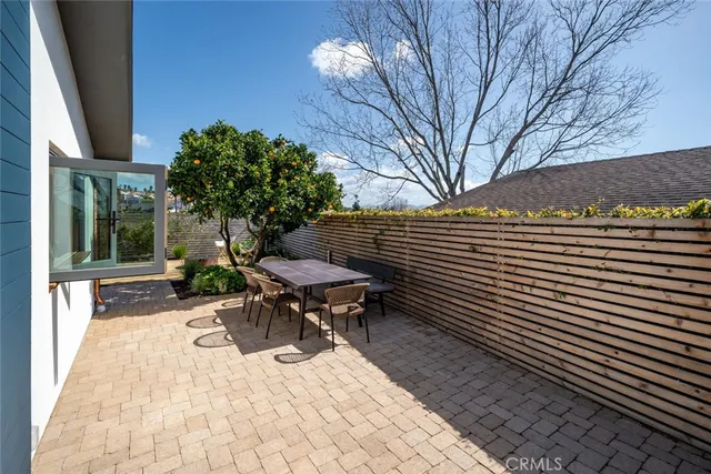 a view of a swimming pool with seating space