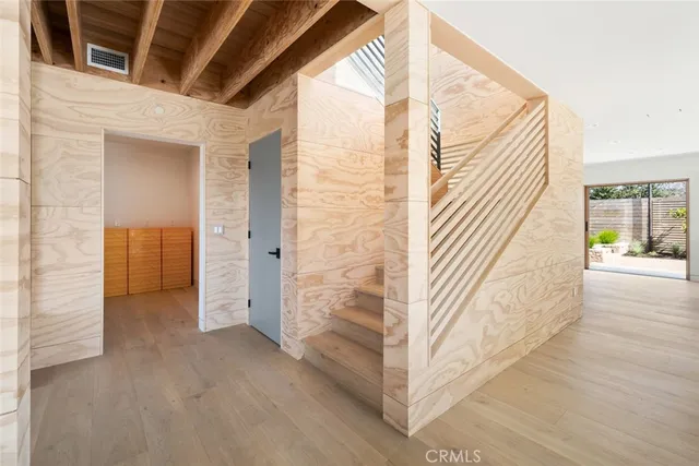 a view of a door and wooden floor