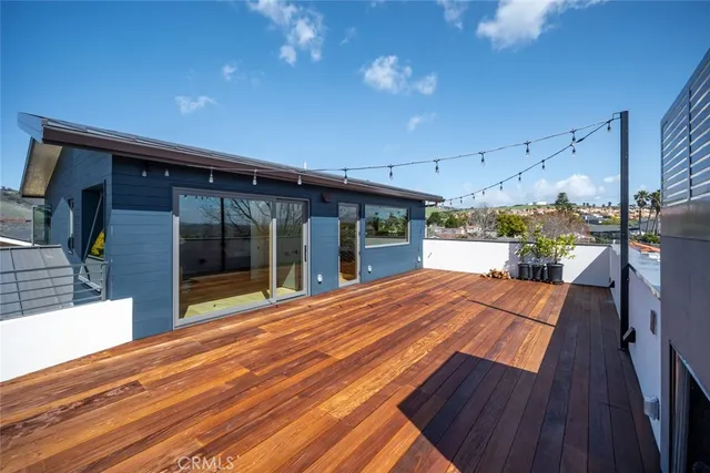 a bedroom with furniture and a potted plant