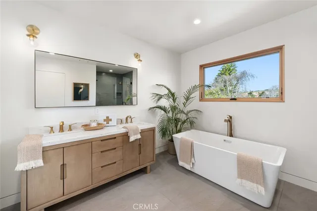 a hallway with furniture and a large window