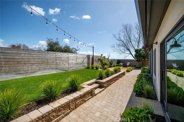 a view of a living room with wooden floor