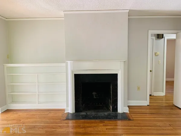 a living room with a fireplace