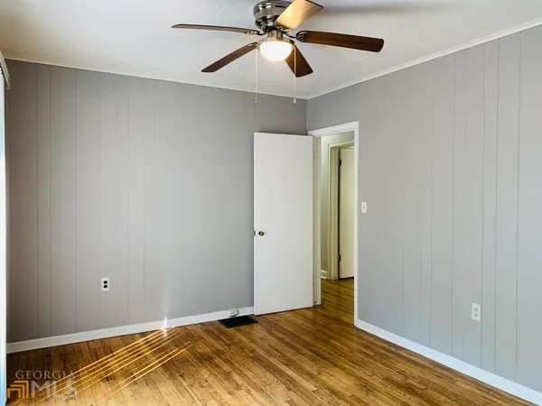 a view of room with wooden floor