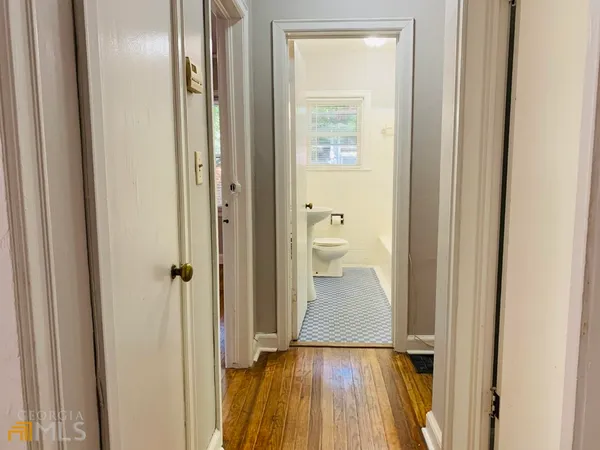 a bathroom with a toilet a sink and bathtub