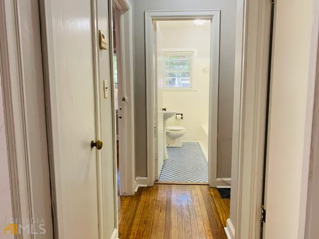 a bathroom with a toilet a sink and bathtub