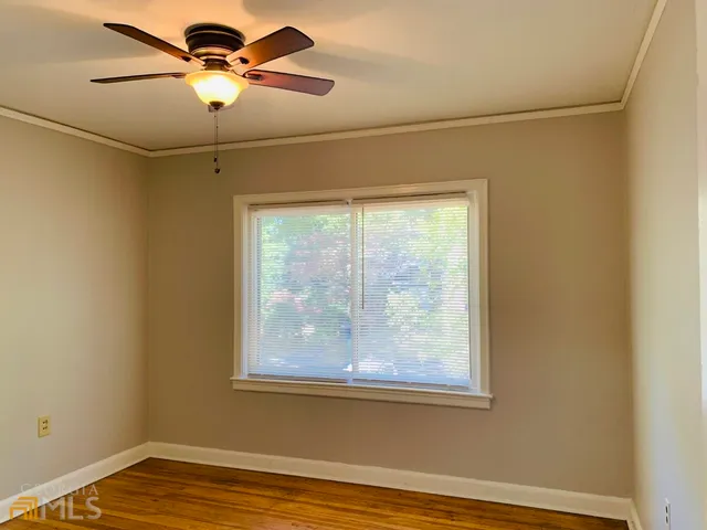 a view of a room with wooden floor and closet