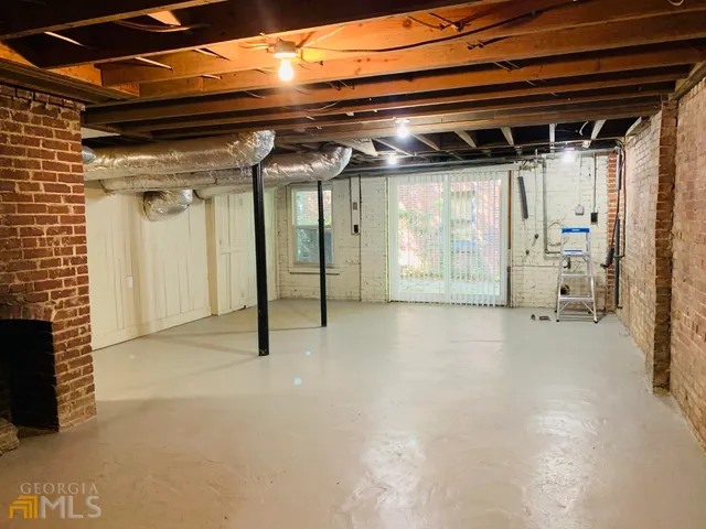 a view of empty room with wooden walls