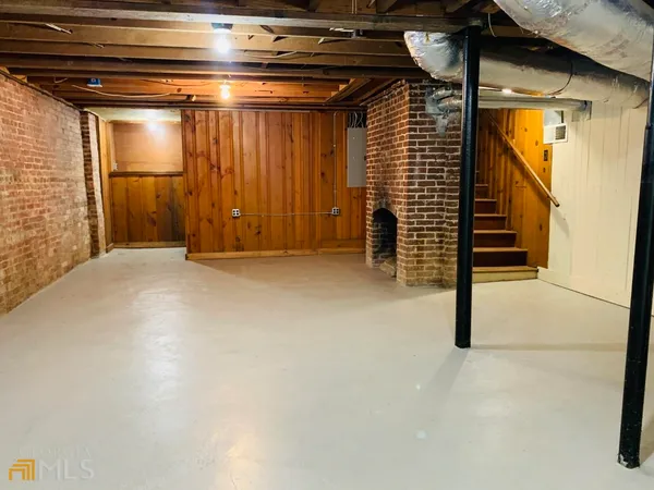 a view of a garage with stairs